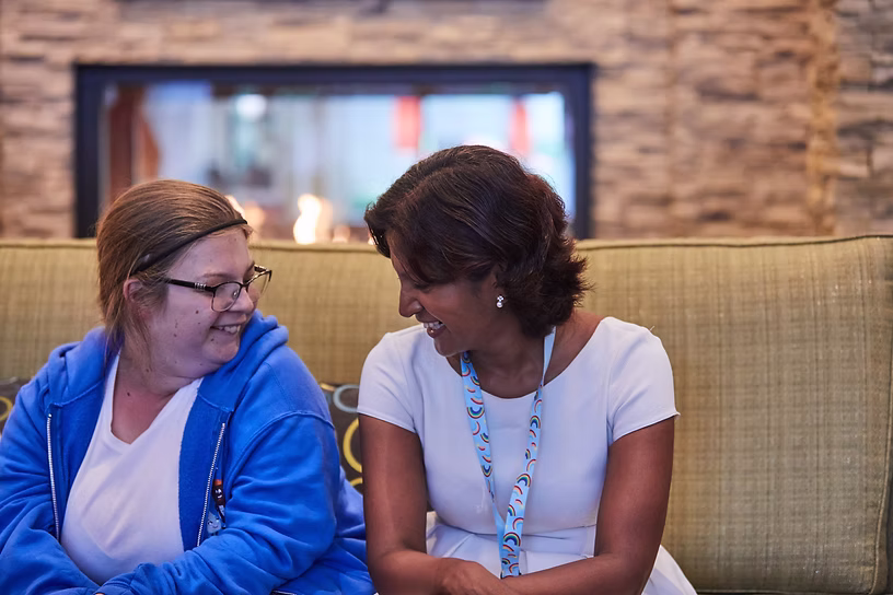 Mary chatting with Dr. Meena Balasubramanian at the HNRNP conference